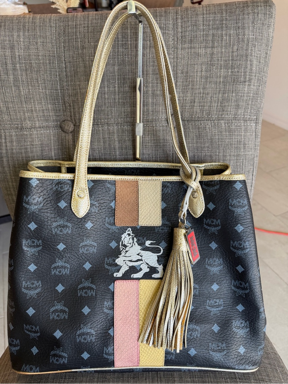 MCM Black Logo Tote with Multicolor Stripe and Gold Tassel